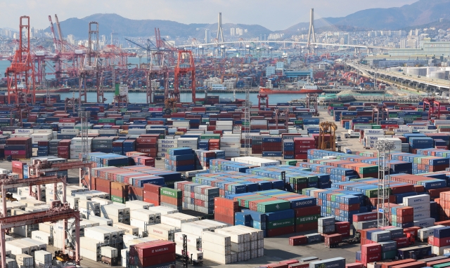 Shipping containers are stacked at a port in the southeastern city of Busan, in this file photo taken Nov. 29. (Yonhap)