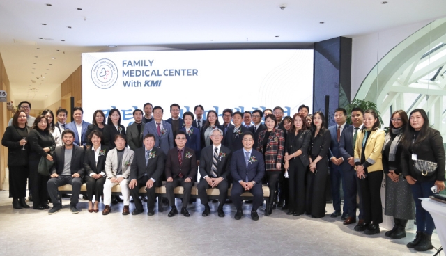 Korea Medical Institute’s Chief Strategy Officer Lee Kwang-bae (front row, first from the right), poses for a photo with board members and employees of KMI and Mongolia's Family Medical Center at the opening ceremony of their joint medical center in Ulaanbaatar on Oct. 25. (Korea Medical Institute)