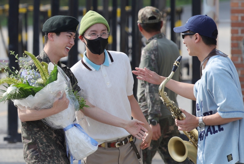 BTS' Jin returns from military duty amid warm welcome from bandmates
