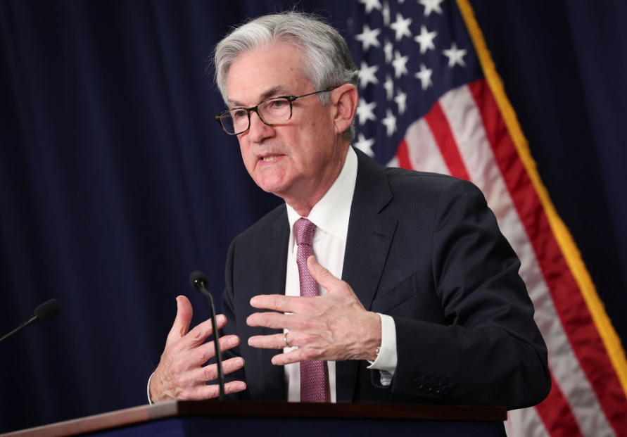 Fed freezes key interest rate, forecasts one rate cut this year