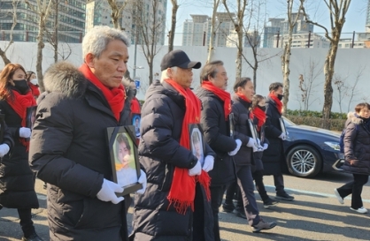 Families of crowd crush victims hold memorial rally in downtown Seoul
