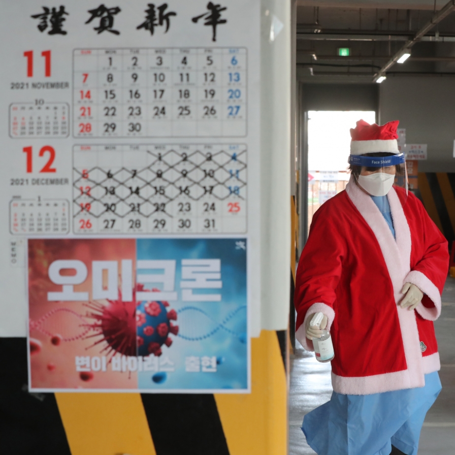  Medical workers dress up as Santa Claus at a COVID-19 testing center