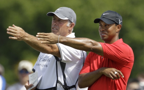 Tiger dumps longtime caddie