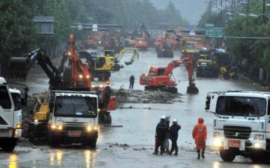 Rain triggers more landslides, flash floods