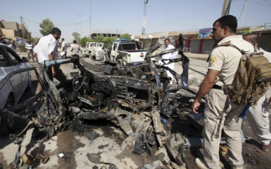 Bombs tear through 17 Iraqi cities, 63 killed