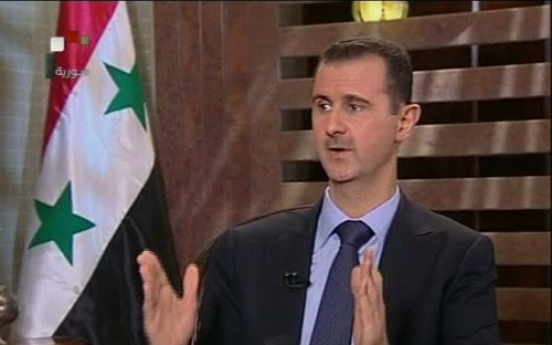 Assad warns against foreign intervention