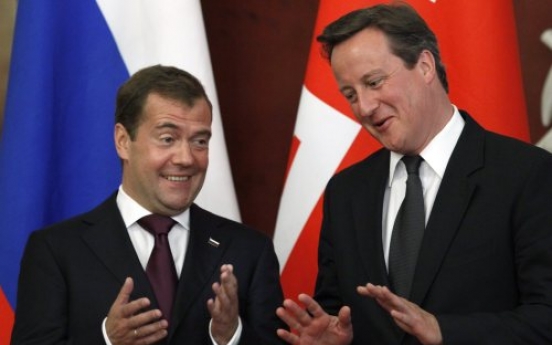 Cameron urges U.K., Russia to mend trade ties