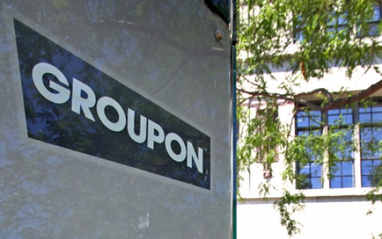 Groupon says sales half earlier figure, loses COO