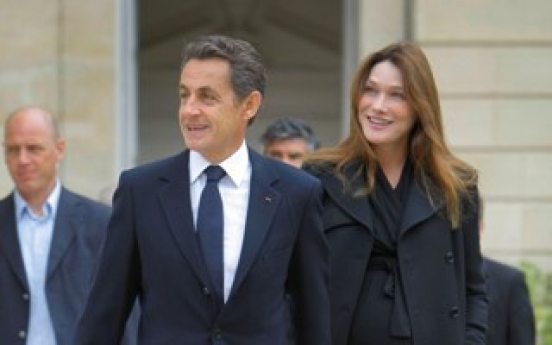 Sarkozy‘s flower power won over Bruni