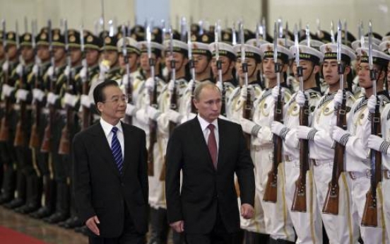 Russian PM Putin in China seeking closer ties