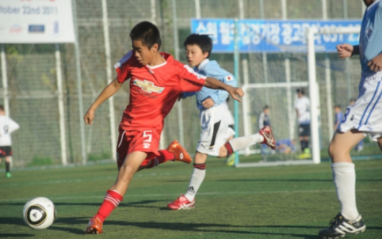 Orphans and international kids meet on the field