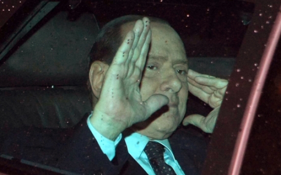 Berlusconi to resign amid debt woes