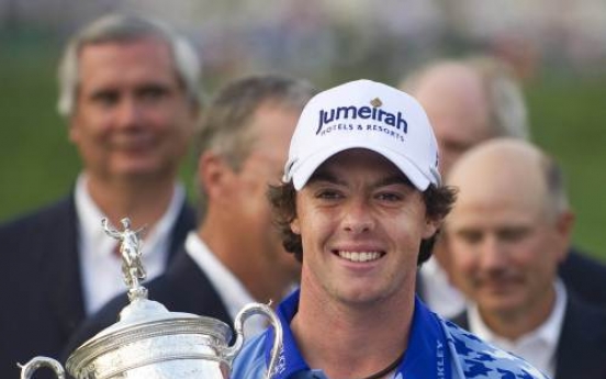 Clarke, McIlroy honored by Queen after major wins