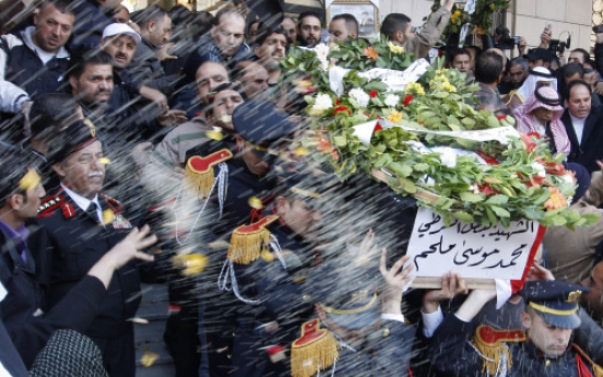 Syria buries bomb victims, threatens ‘iron fist’