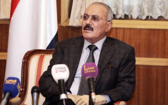 Saleh out, Yemenis remain cautious