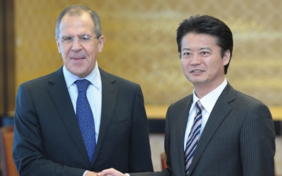 Japan, Russia to boost ties despite islands row