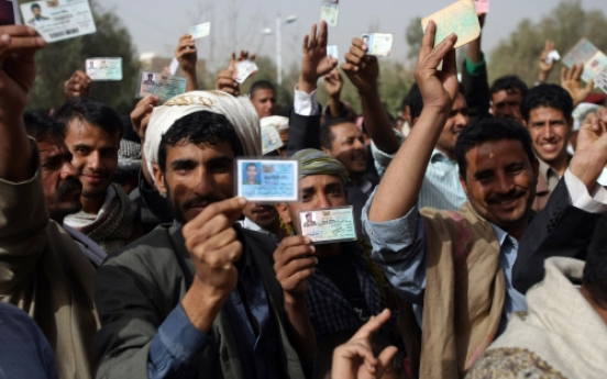 Yemenis vote as Saleh’s 33-year rule comes to end