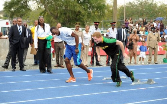 Prince Harry runs with Bolt in Jamaica