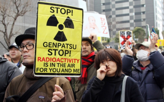 Protesters link arms around the world to decry nuclear power