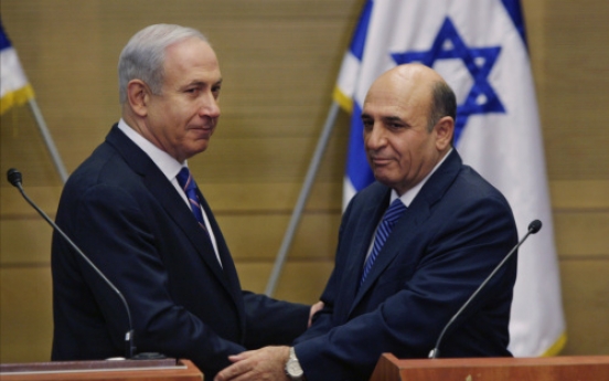 Israel P.M. unveils shock coalition deal with Kadima