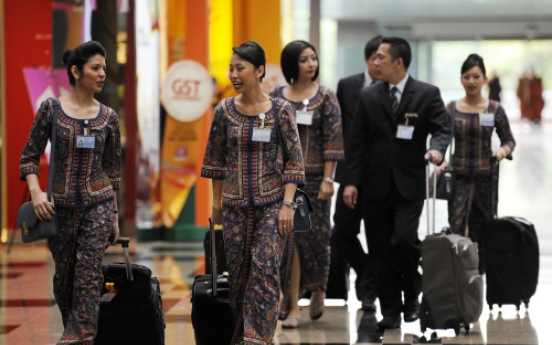 Asian airlines post slow growth on fuel