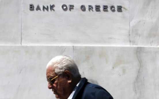 Fitch downgrades Greece, cites euro exit risk