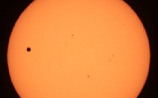 Eyes turn skyward as Venus travels across the sun