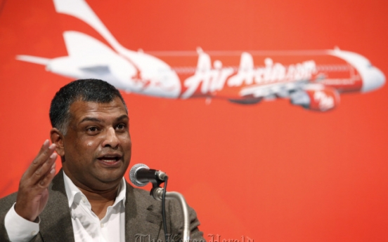 AirAsia parlays planes into phones, hotels