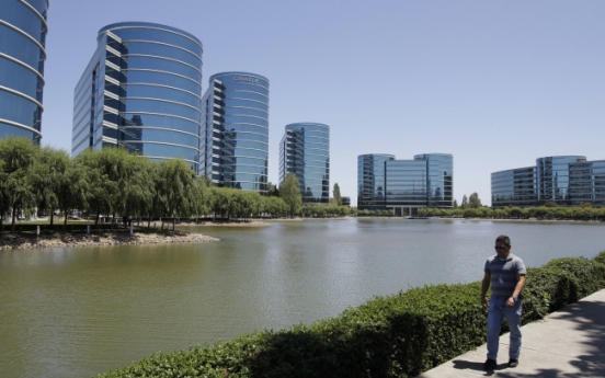 Oracle’s quarterly earnings up 8 percent, exceeding analyst views