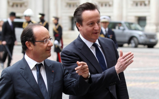 Hollande, Cameron laugh off differences