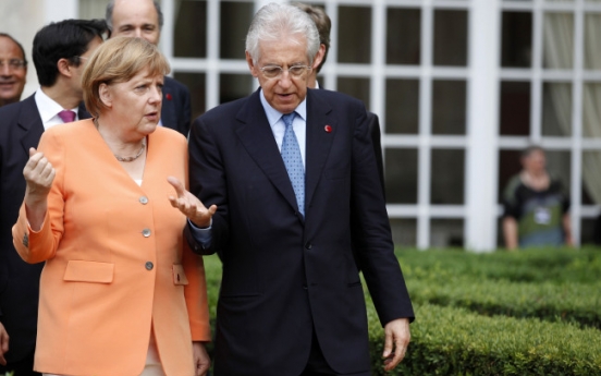 Merkel, Monti vow to protect eurozone