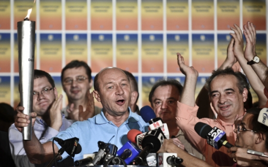 Basescu survives impeachment vote