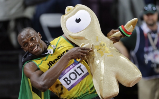 Bolt defends his Olympic 100 title in London