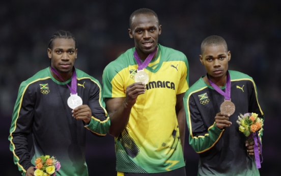 Bolt wins 200, Rudisha gets 800 record at Olympics