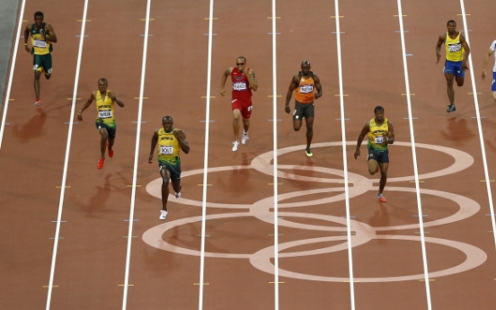 Usain Bolt first man to duplicate 100-200m Olympic double