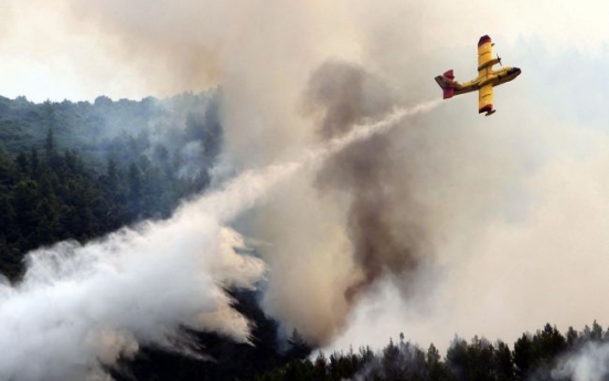 Wildfires rage near Spanish, Greek world heritage sites