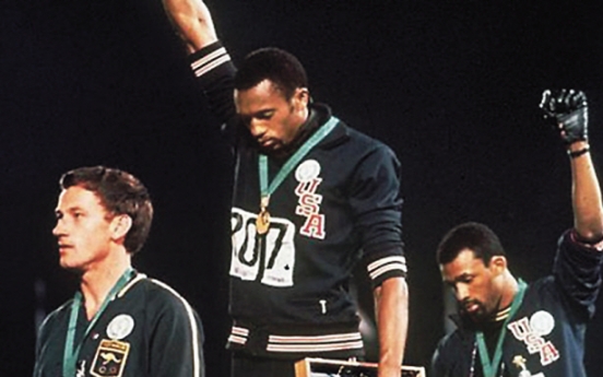 Apology offered to athlete on black power podium