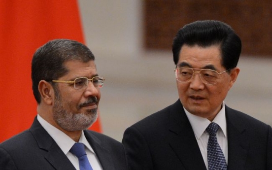 Wary of Arab Spring, China hosts Morsi