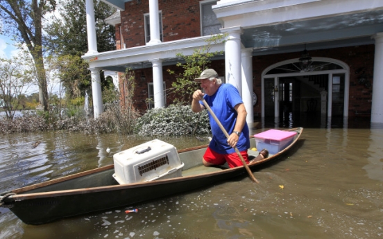 Days after Isaac, flooding and outages remain