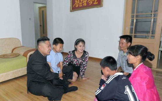 Kim visits homes of workers