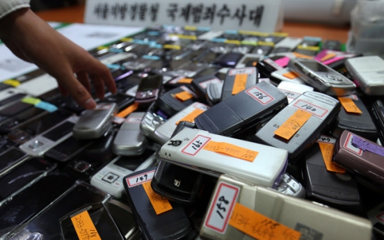 Two arrested for selling phones with forged foreigner identities