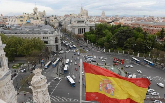 S&P cuts Spain rating to near junk