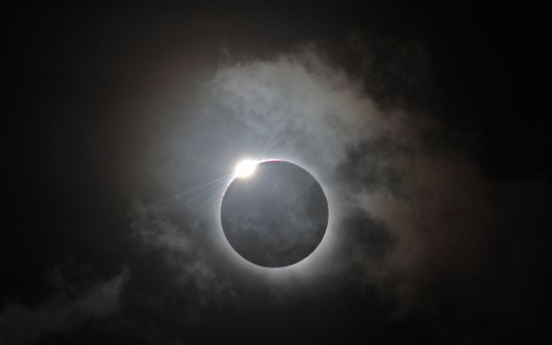 Sky-gazers in awe of total eclipse