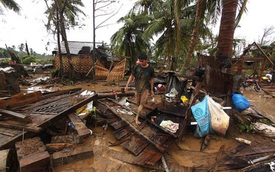 Powerful typhoon kills at least 74 in Philippines