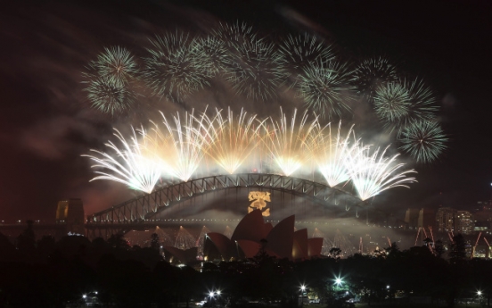 World gives enthusiastic welcome to 2013