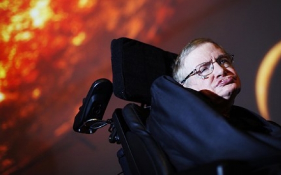 Stephen Hawking conjures black hole in ad