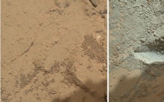 Martian rover drills first rock