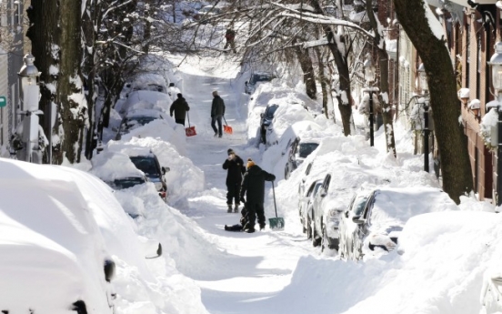 U.S., Canada dig out after storm