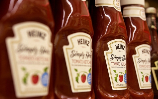 Buffett buys Heinz for $23 billion