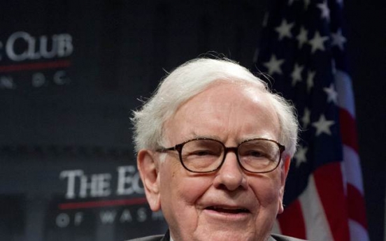 Buffett firm’s profits rise on paper gains